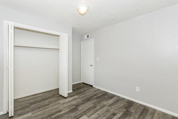 A room with a white door and a white wall.