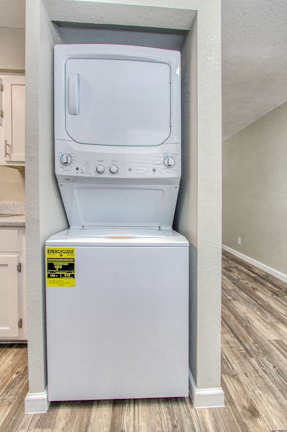 A white oven with a sticker on the bottom.