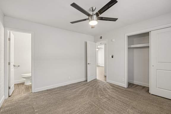 A room with a ceiling fan and carpeted floor at Palm Villas Apartments, Scottsdale, AZ 85257