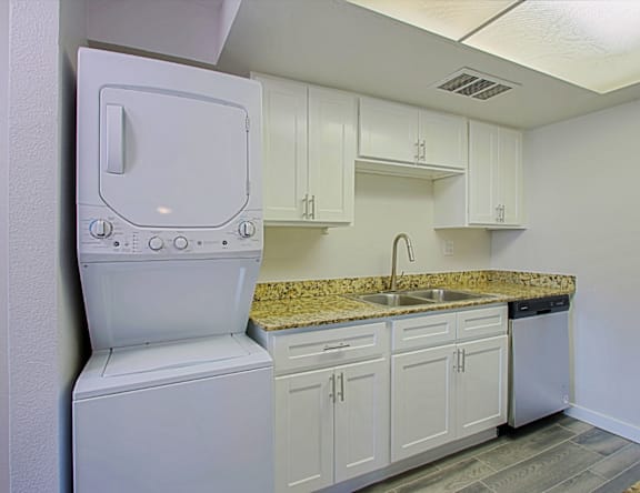 A white oven and sink in a kitchen.