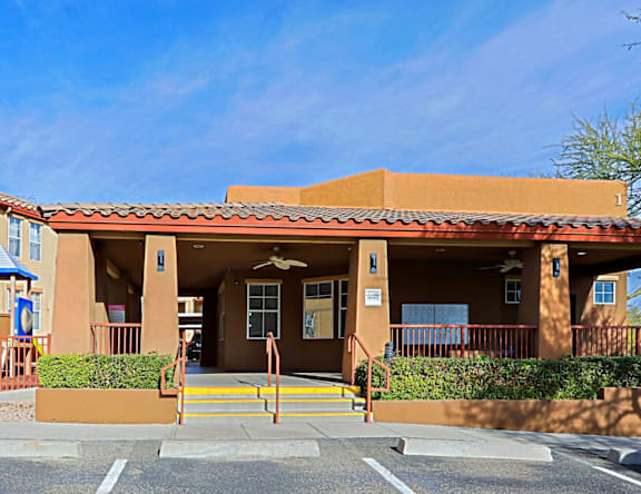 A building with a red tile roof and a sign that says "1" on it.