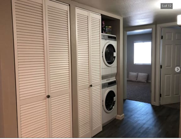 A laundry room with a washer and dryer in it.