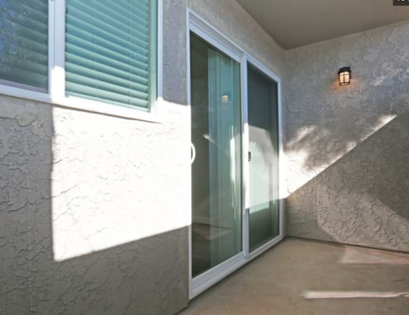 A glass door is in a white frame.