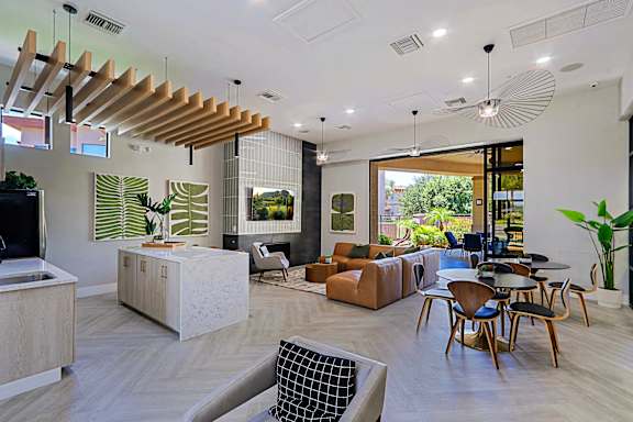 A modern living room with wooden furniture and a large window.