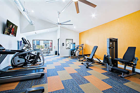 Gym with cardio equipment and a large window at Aspire Thunderbird, Glendale