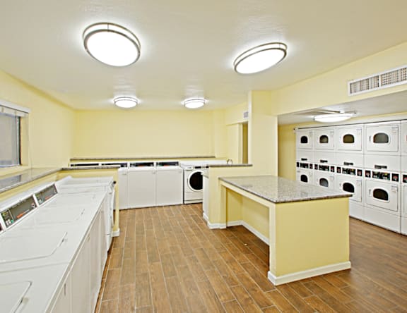 A laundry room with a washer and dryer in it.
