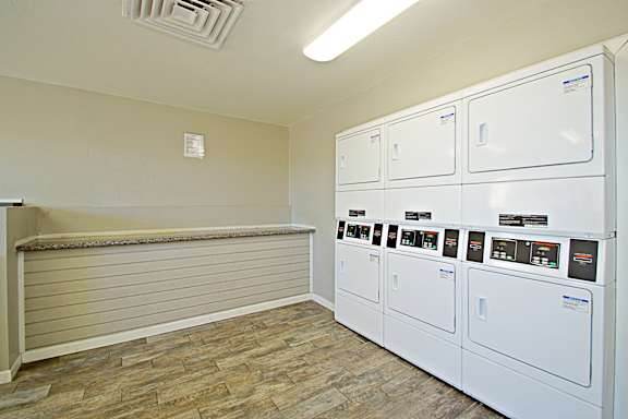 A room with a wall of electrical boxes.