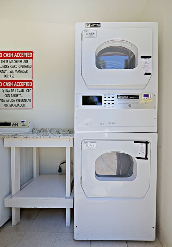 A washing machine and dryer are stacked on top of each other.