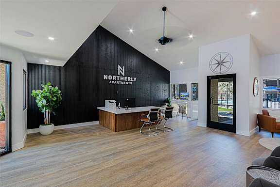 A reception area for the Northernly Apartments with a black and white color scheme.