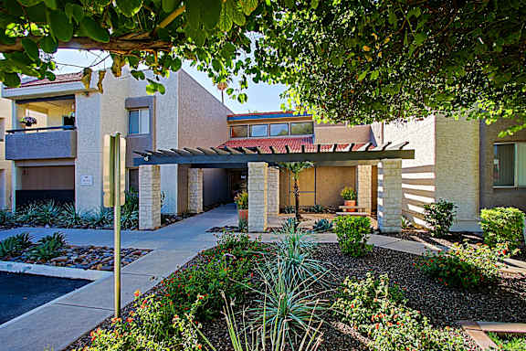 A modern house with a garden in front.