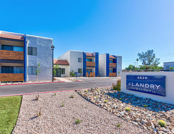 The image shows a modern building with the sign "LANDRY on MCDOWELL" in front of it.