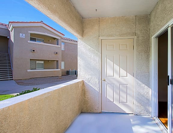A white door is open to a hallway.