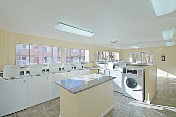 A laundry room with a washer and dryer in it.