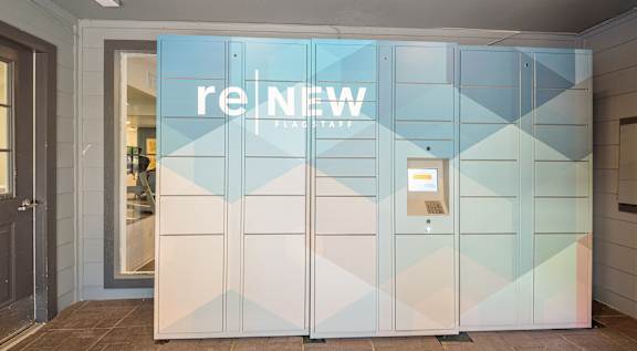 A glass door with a sign that says "reNEW" on it.
