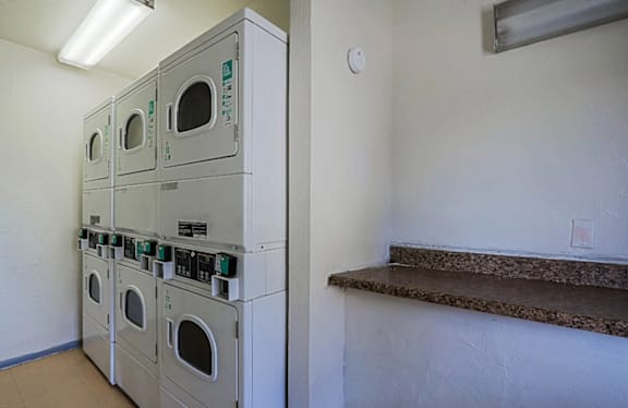 Row of dryers in laundry room at Sahuaro West Apartments, Phoenix, Arizona