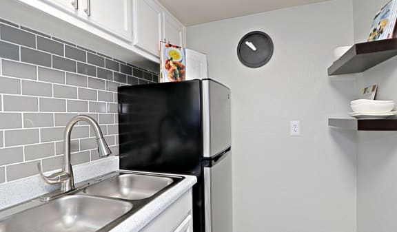 View of Refrigerator and Sink with Silver Faucet at Summer Point in Glendale, AZ