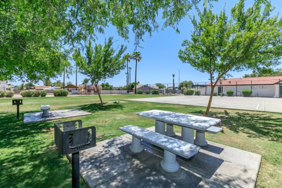 Private picnic areas with two grills and two while picnic tables with benches at Tides at Mesa, Mesa, Arizona