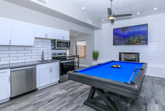 Resident lounge with billiards table and demo community kitchen  at Tides at Mesa,Mesa, AZ