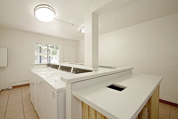 a kitchen with a counter top and a sink