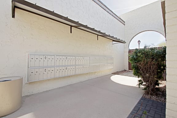 the driveway to the side of the building has a garage door