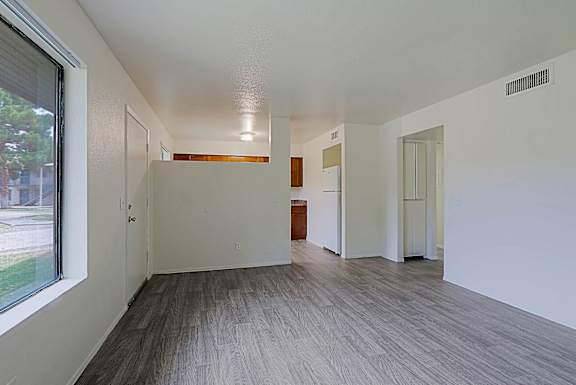 A room with a window and a door.