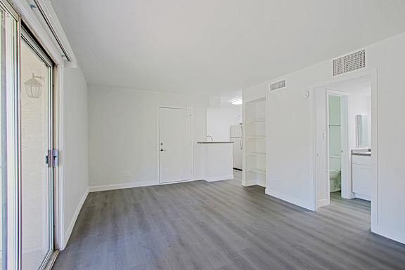 A room with a grey floor and white walls.