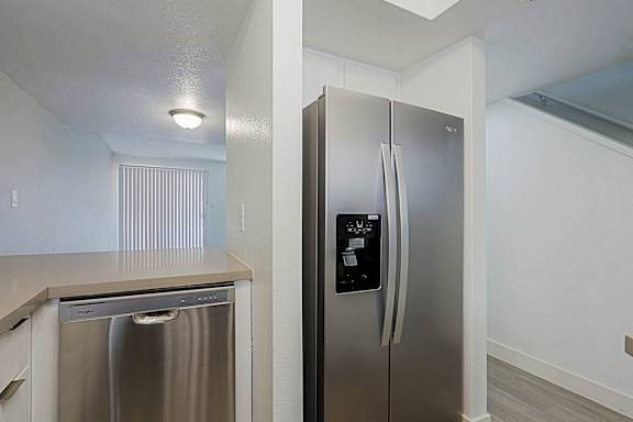 A stainless steel refrigerator with a digital display and water and ice dispenser.