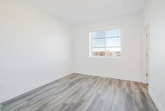 an empty room with white walls and a window an empty room with white walls and a window at 2051 Apartments, Arizona