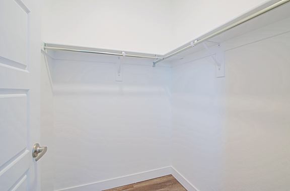 a walk in shower in a white room with white walls and a door a walk in shower in a white room with white walls and a door at 2051 Apartments, Prescott, AZ, 86301