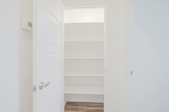 a white closet with shelves and a white door a white closet with shelves and a white door at 2051 Apartments, Prescott, AZ, 86301