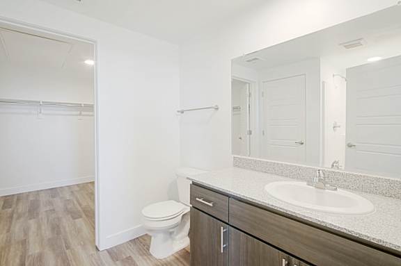 a bathroom with a sink and a toilet and a mirror a bathroom with a s at 2051 Apartments, Arizona, 86301