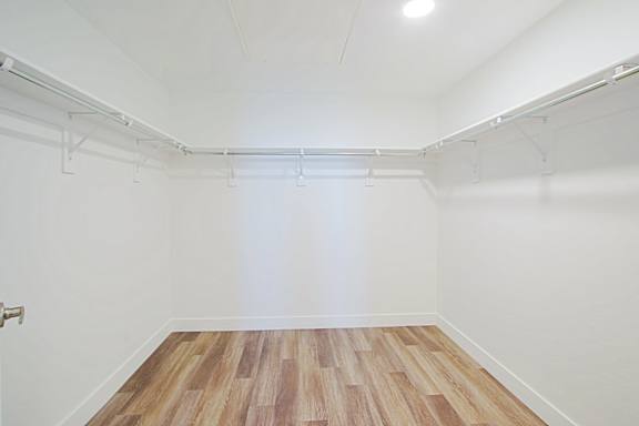 an empty room with white walls and a wood floor an empty room with white walls and a wood floor at 2051 Apartments, Prescott, AZ