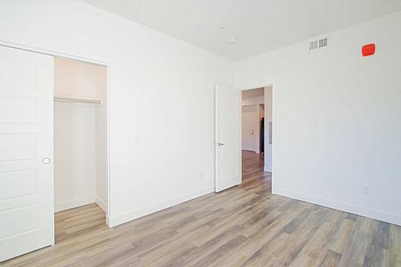 a renovated living room with white walls and wood floors at 2051 Apartments, Prescott, 86301