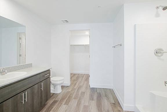 an empty bathroom with a toilet and a sink at 2051 Apartments, Arizona