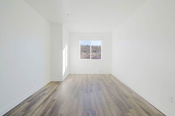 an empty room with white walls and a window at 2051 Apartments, Prescott, 86301