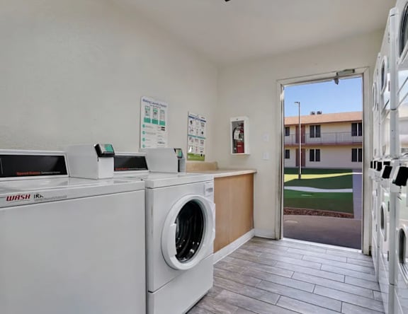 A laundry room with a washer and dryer.