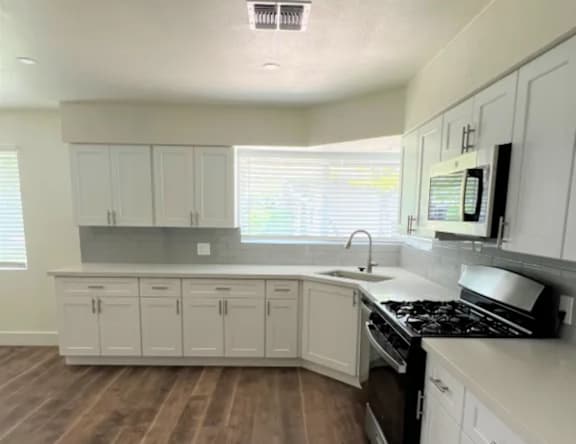 Apartment kitchen — representative home at Pomelo Park.