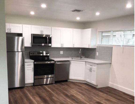 Apartment kitchen — representative home at Pomelo Park.