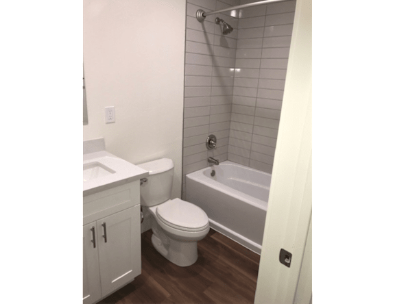Apartment bathroom — representative home at Pomelo Park.