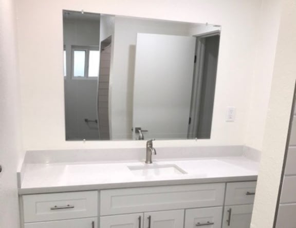 Apartment bathroom — representative home at Pomelo Park.
