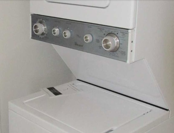 A white oven with a control panel on top.