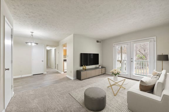 Living Room with patio access at Bradford Gwinnett Apartments, Norcross, GA