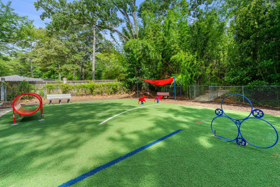 children playing on a playground with nets and hoops at Georgian Oaks Apartments, Smyrna , GA