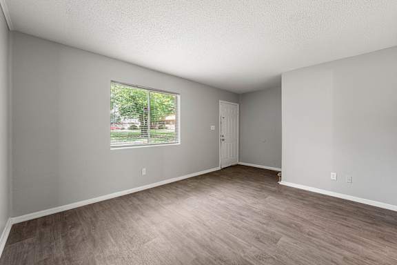 A room with a window and a door.