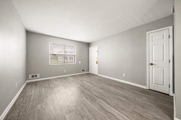 A room with a door and a window.