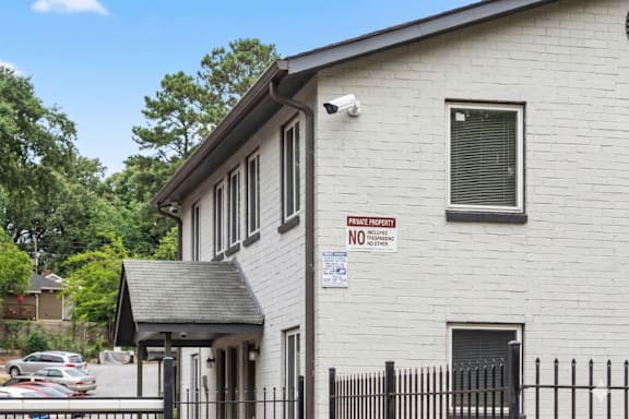 A house with a sign that says "PRIVATE PROPERTY NO TRESPASSING".