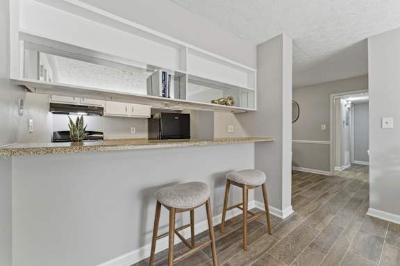 Kitchen with bar stool at The Reserve at Brookhaven, Atlanta, 30329