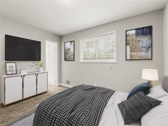 Modern bedroom with TV at Pinewood Townhomes, Tucker, Georgia