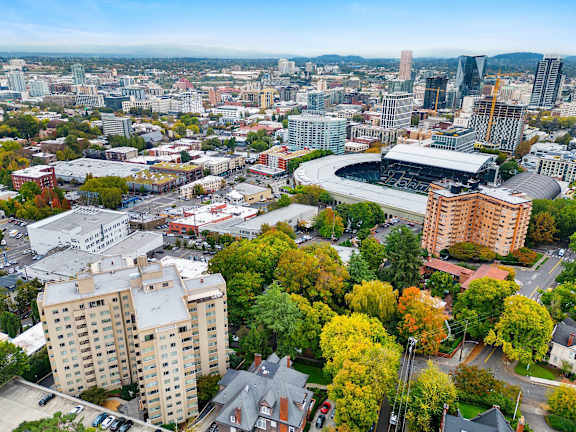 an aerial view of a city with buildings and trees