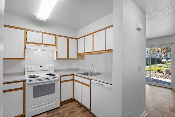 a view of a kitchen with a large window